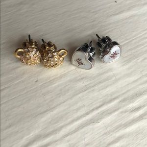 Two pairs of Juicy Couture classic earrings.